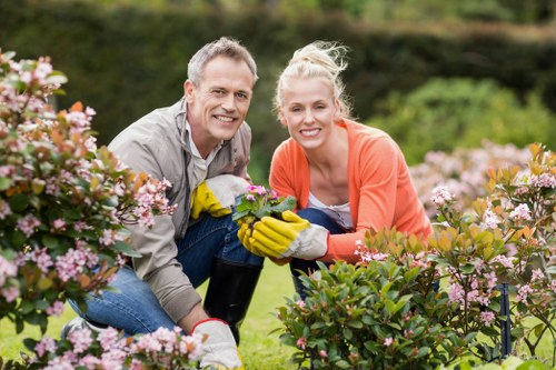 Worker carrying out a landscaping risk assessment before starting work